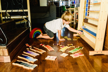Children playing and learning with montessori color tablets