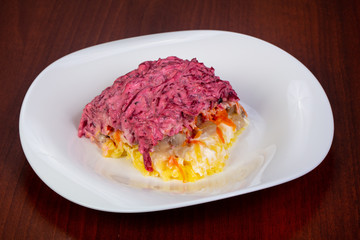 Russian salad with herring and beetroot