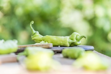 green peppers on wooden table 