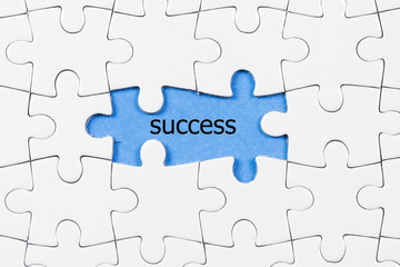 Fototapeta premium puzzle pieces with success word