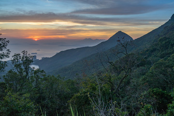 Scenic sunset from Hong Kong Victoria Peak, with South China Sea on the background