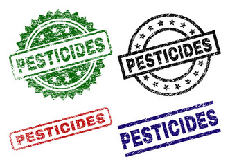 PESTICIDES seal prints with corroded texture. Black, green,red,blue vector rubber prints of PESTICIDES label with dirty texture. Rubber seals with round, rectangle, medal shapes.