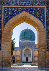 View of Gur-e Amir mausoleum of Timur through the entrance - Samarkand, Uzbekistan. Its architectural complex contains the tombs of Tamerlane, his sons and grandsons.