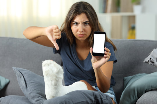 Angry disabled girl showing a blank phone screen