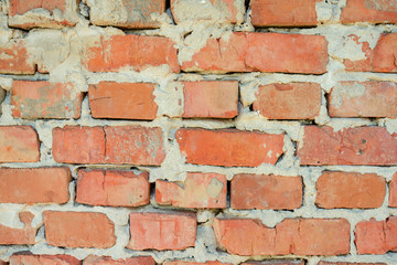 Obraz premium red brick wall texture grunge background with vignetted corners, may use to interior design