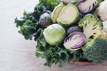 cruciferous vegetables, cauliflower,broccoli, Brussels sprouts, kale in wooden bowl, reducing...