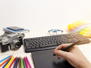 Graphic designer point of view of desk 