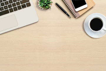 Office desk with hot coffee, plant, laptop, notebook,color note paper and smartphone on top view and copy space. Business desk minimal and modern style concept.