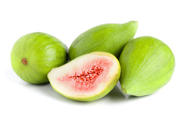 Ripe green fig fruit and half isolated on white background