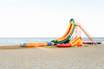 inflatable slide on the sea, the sea shore