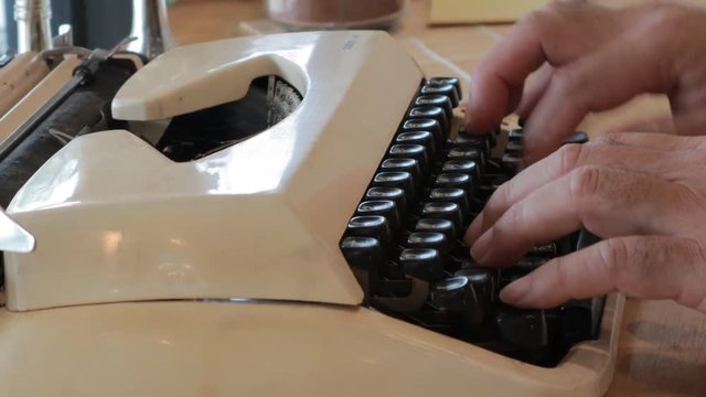 Video Clips people print a document by typewriter
