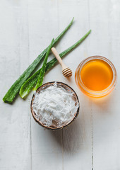 Scrambled coconut In coconut shell Aloe Vera And honey in a glass