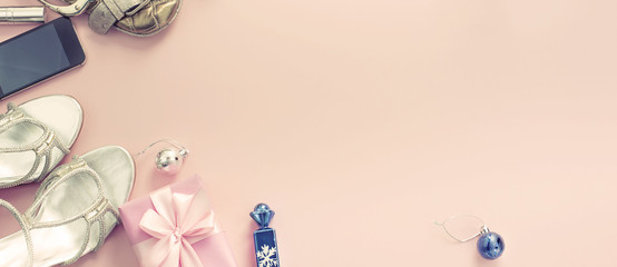 Banner Christmas background pink Flat Lay fashion accessories handbag sandals phone gift box bow balls.