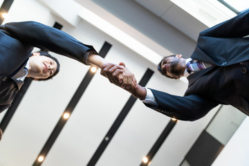 Business partnership concept. Shaking hands.