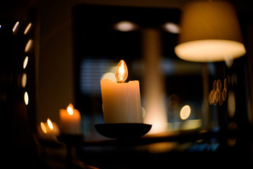 Candle in the dark, wedding candle with bokeh light background