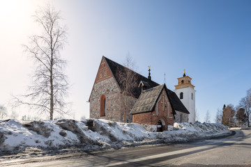 Fototapeta premium Winter view over gammelstad church, an UNESCO world heritage site close to the city of Lulea, Sweden.