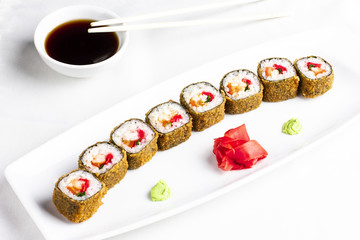 Japanese sushi rolls with crabmeat on white background