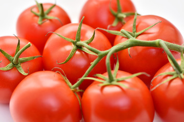 Isolated tomatoes on a white background.