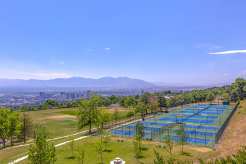 Tennis court with Salt Lake city downtown