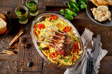Portion of roasted lamb chops and saffron rice