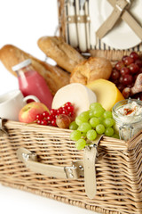 Fresh grapes and red currants in a picnic hamper
