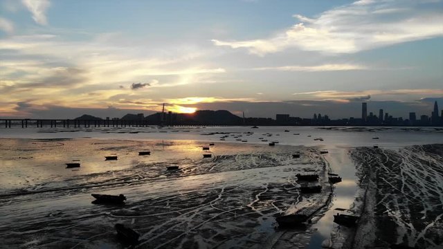 lau fau shan wetland with the skyline of shenzhen