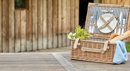 Open vintage fitted picnic hamper with baguettes