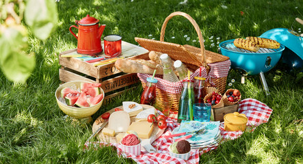 Angled view of picnic blanket and basket