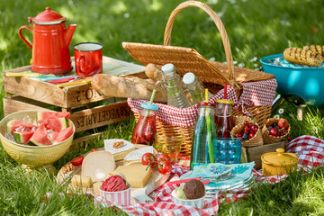 Country barbecue or picnic in a spring meadow - obrazy, fototapety, plakaty