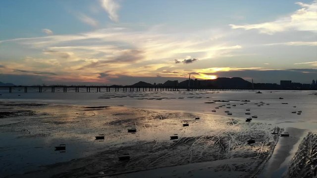 lau fau shan - pak nai mudflat in hong kong with the skyline of shenzhen