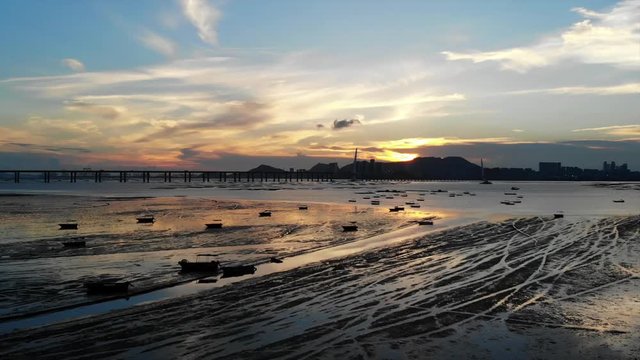 lau fau shan - pak nai mudflat in hong kong with the skyline of shenzhen