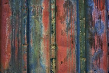 The wall of an old rusty sea container. Strong wear and tear during operation