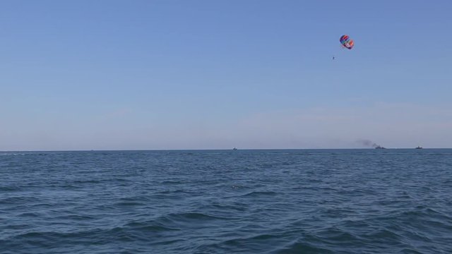 Parasailing in a blue sky on Black Sea