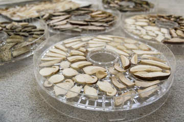 Close-up of baking slices of mushrooms.
