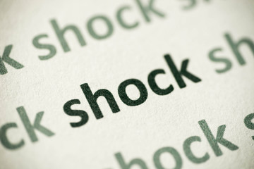 word shock printed on paper macro