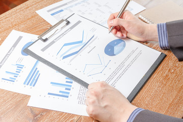 business man analyzing graph and chart document report