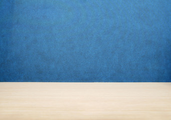 top side 45 degrees view brown wood table or desk with blue texture wall or partition and board background for place your product or object and text on board
