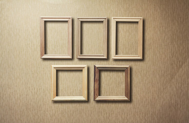 Fototapeta premium old frames on wooden wall
