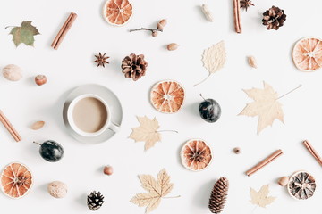 Autumn composition. Cup of coffee, dried leaves, cinnamon, star anise, cones, light background. Autumn elegant concept. Flat lay, top view, copy space 