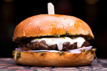 Great Burger beefon a wooden table
