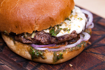 Great Burger beefon a wooden table