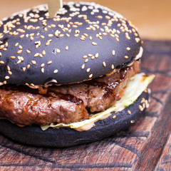 Gourmet black burger with Spicy sauce