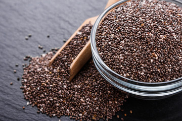chia seeds on a dark stone background