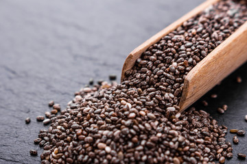 chia seeds on a dark stone background