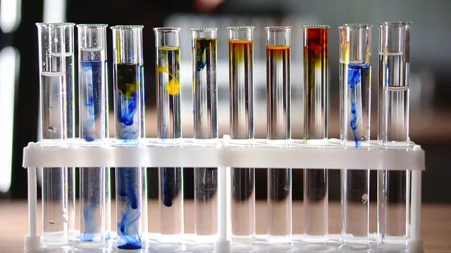 laboratory work on mixing reagents with colors of different colors