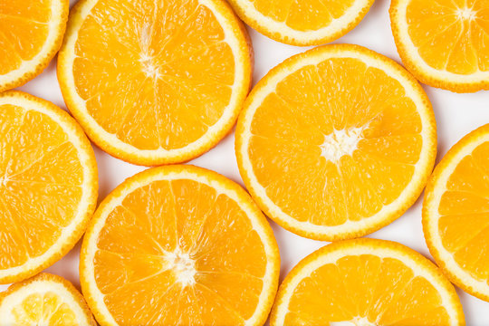 Slices of orange on a white background