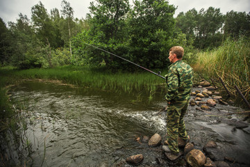 Fisherman catching fish on the river.