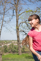 girl in a red t-shirt in the park