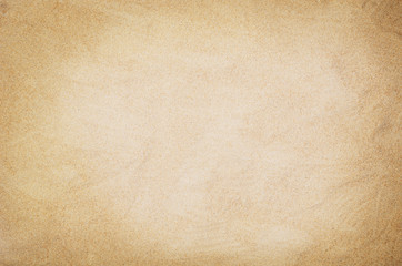 Top view of sandy beach. Background with copy space and visible sand texture.