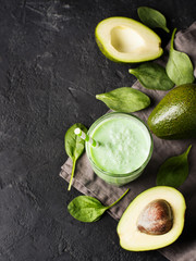 Avocado and spinach smoothie in glass